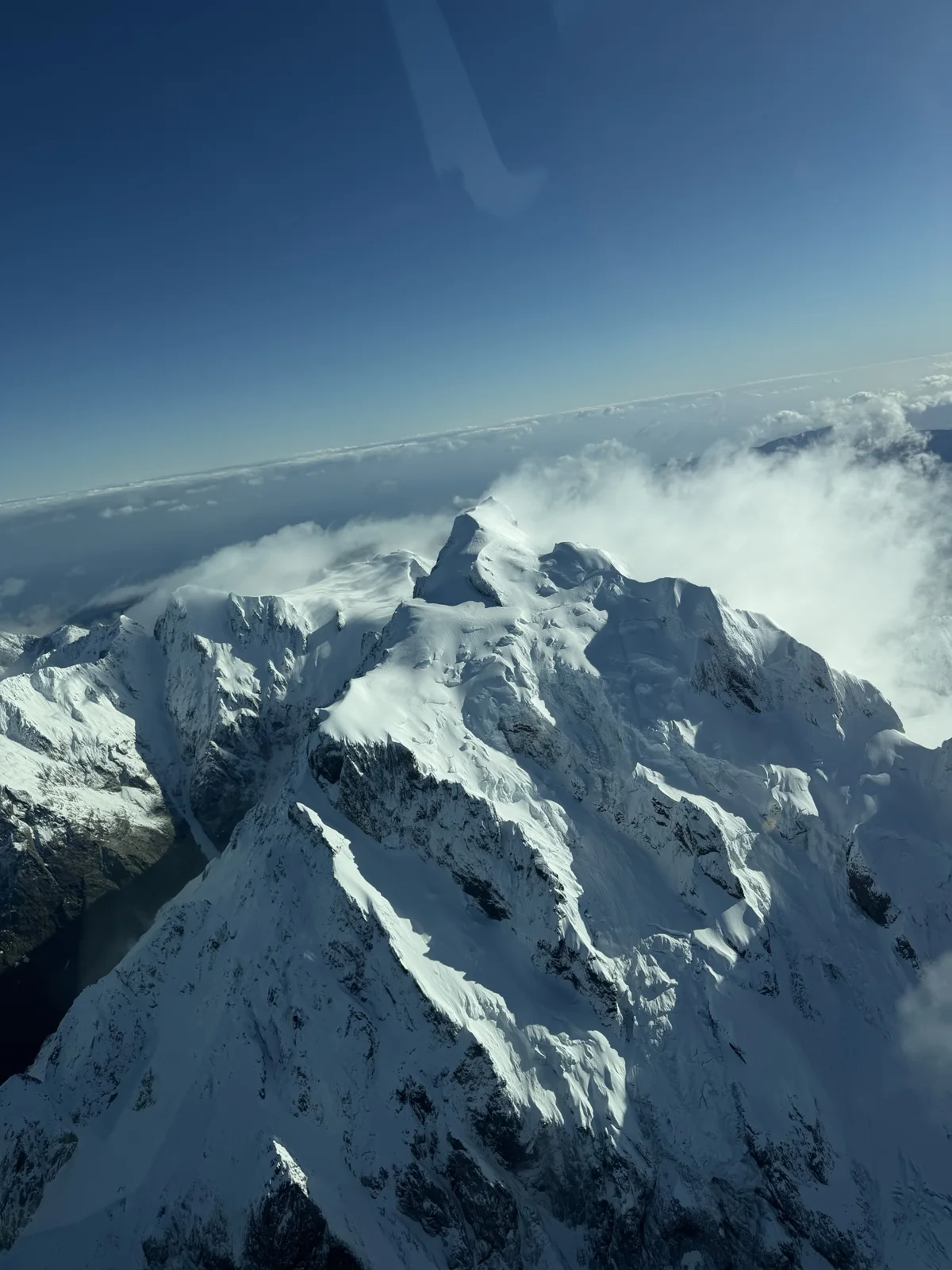 Milford Sound Flight & Cruise — Snowy mountain peaks viewed from the aircraft