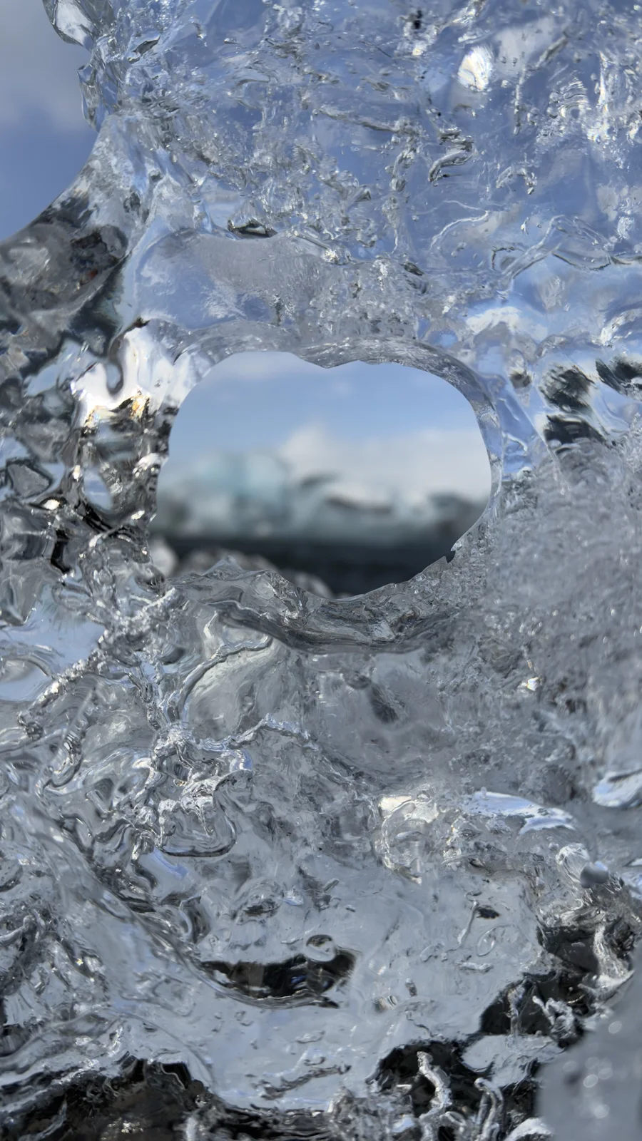 Glacier Lagoon Shore — A close view through a piece of clear ice beside Jökulsárlón lagoon