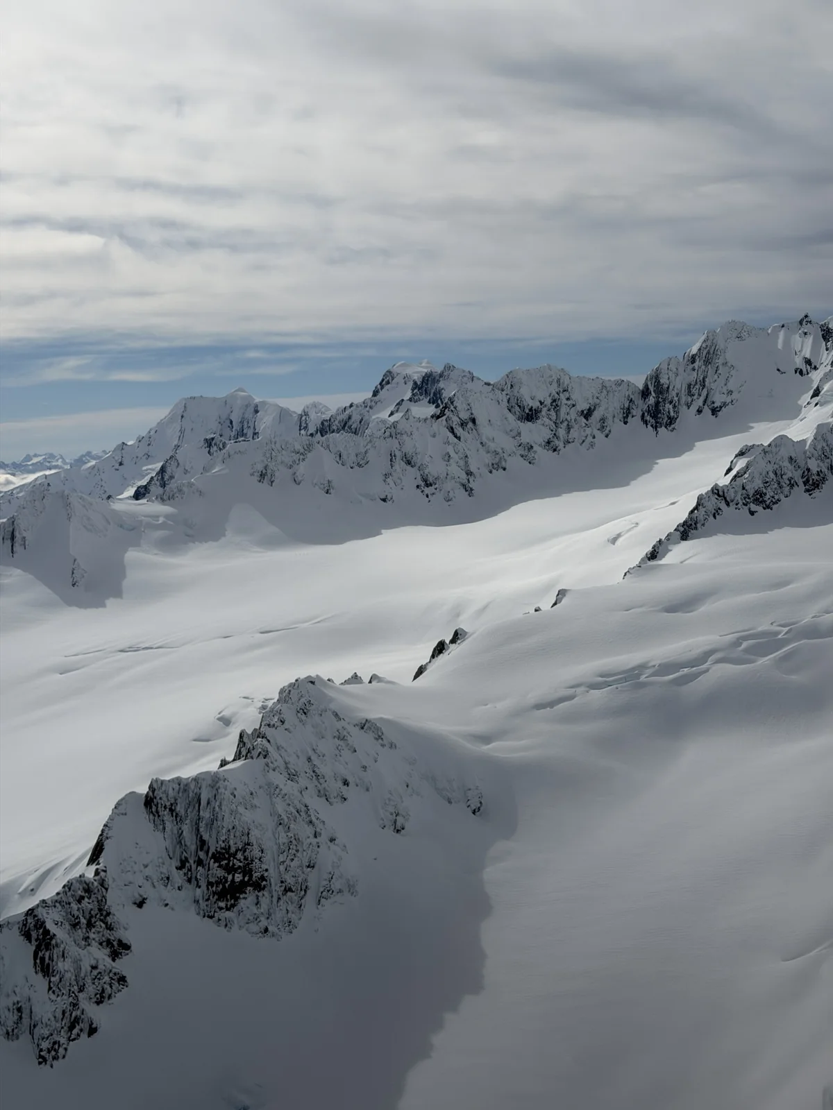 Glacier Helicopter Snow Landing — Snow-covered mountain ranges seen during the glacier helicopter flight